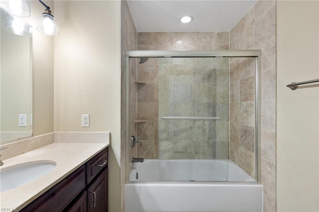 bathroom with enclosed tub / shower combo and vanity