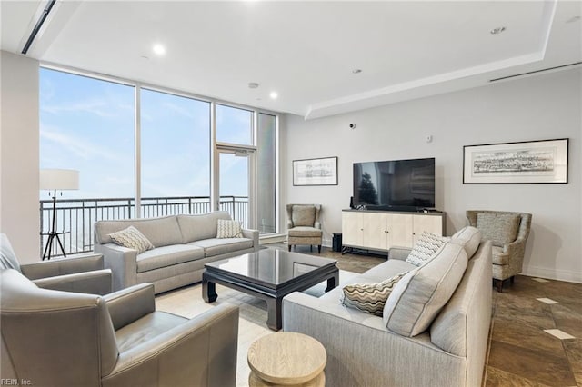 living room with floor to ceiling windows