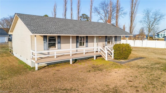 back of property featuring a lawn and a porch