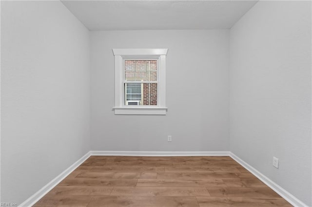 spare room with hardwood / wood-style floors