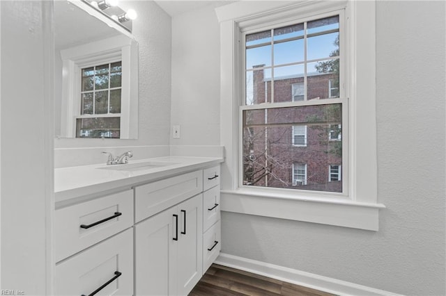 bathroom with vanity and hardwood / wood-style floors