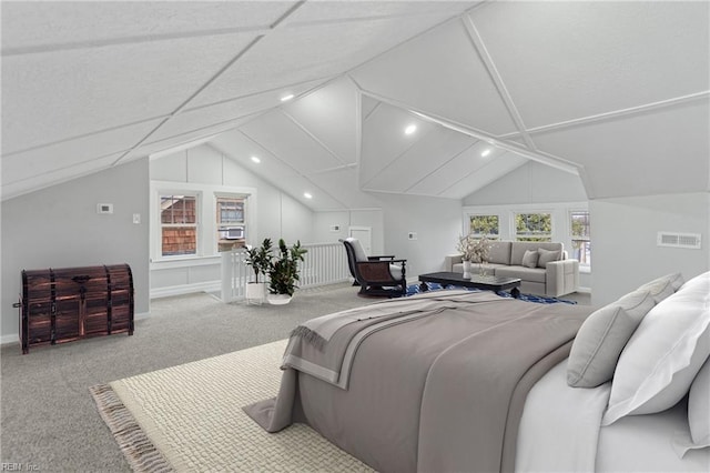 carpeted bedroom featuring lofted ceiling