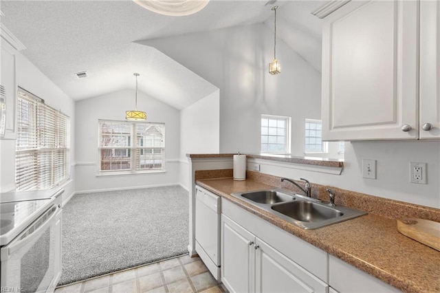 kitchen featuring white cabinetry, sink, decorative light fixtures, and white appliances