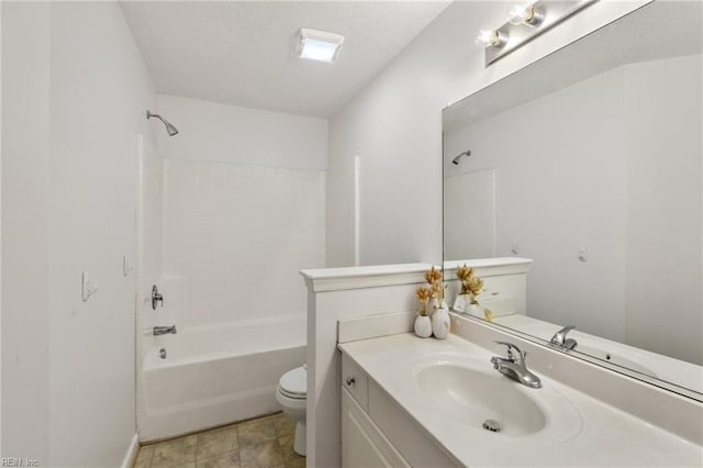 full bathroom with vanity, a textured ceiling, toilet, and washtub / shower combination