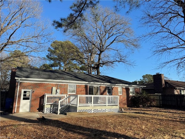 back of property featuring a deck