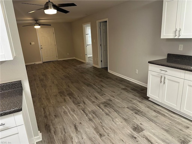 kitchen featuring white cabinetry, ceiling fan, and hardwood / wood-style floors