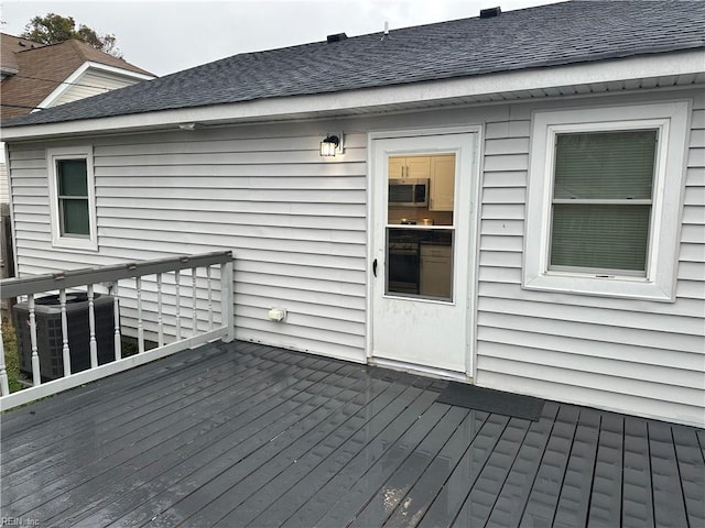 wooden terrace featuring central air condition unit