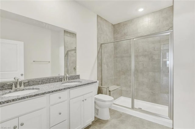 bathroom with vanity, an enclosed shower, tile patterned floors, and toilet