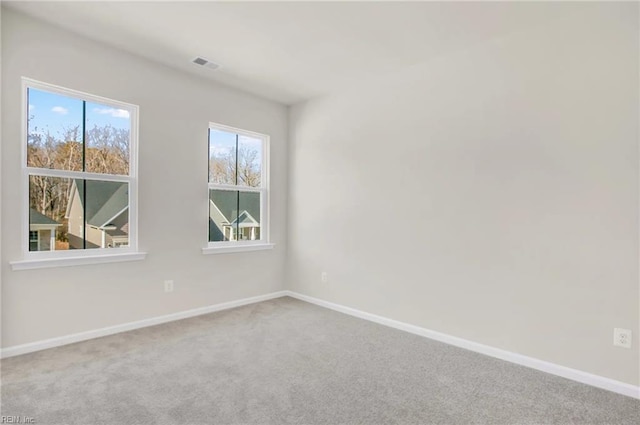 empty room featuring carpet flooring