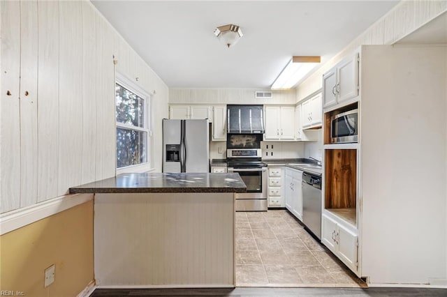 kitchen featuring stainless steel appliances, sink, and white cabinets