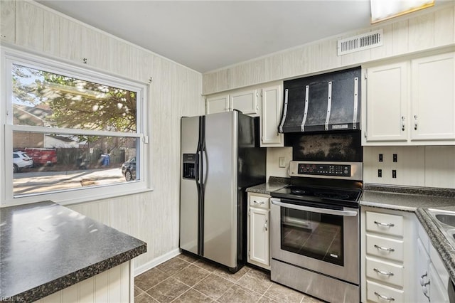 kitchen with stainless steel appliances, ventilation hood, tile patterned flooring, and white cabinets