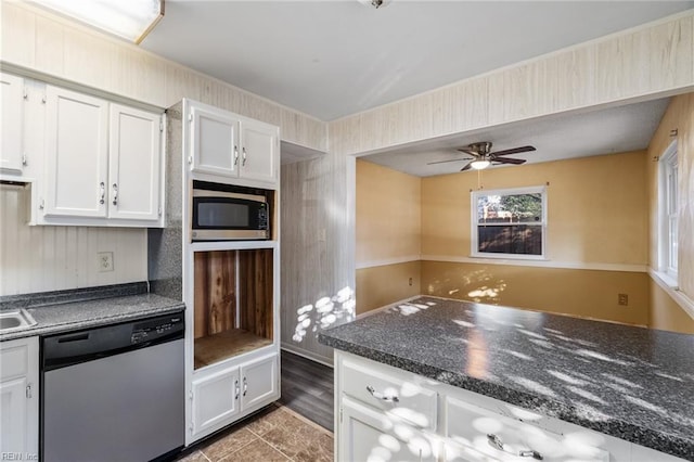 kitchen with ceiling fan, stainless steel appliances, and white cabinets