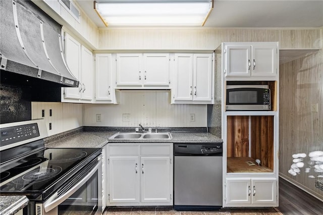 kitchen featuring stainless steel appliances, extractor fan, sink, and white cabinetry