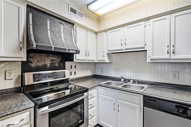 kitchen with white cabinetry, appliances with stainless steel finishes, extractor fan, and sink