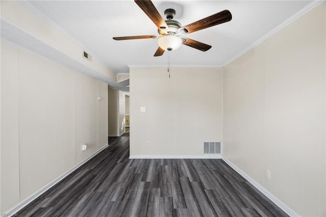 empty room with crown molding, ceiling fan, and dark hardwood / wood-style flooring