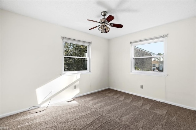 unfurnished room with carpet floors and ceiling fan