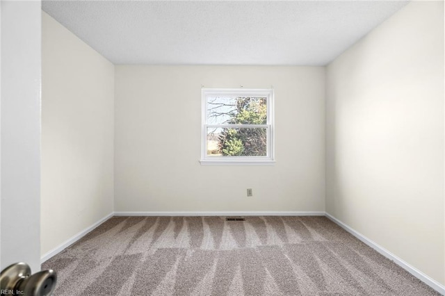 spare room with carpet flooring