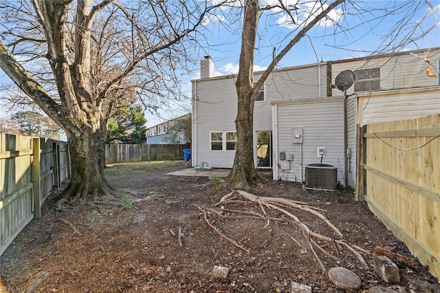 rear view of property featuring cooling unit