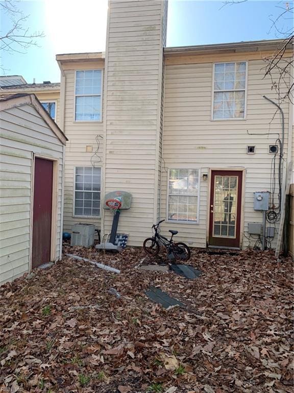 back of property featuring cooling unit