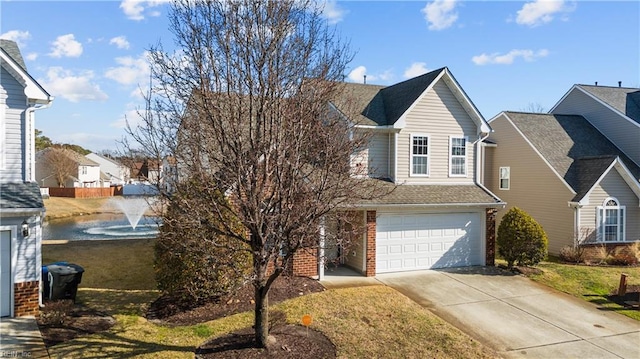 view of front of property with a garage and a front yard