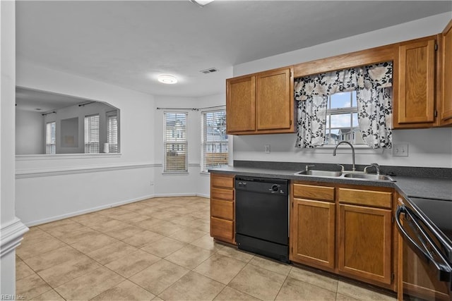 kitchen with light tile patterned floors, sink, and black appliances