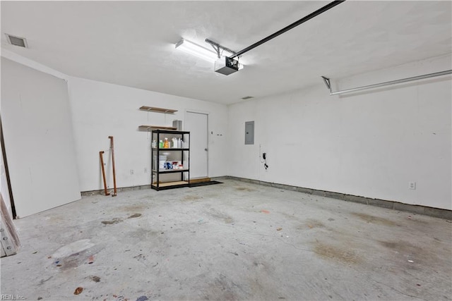 garage featuring a garage door opener and electric panel