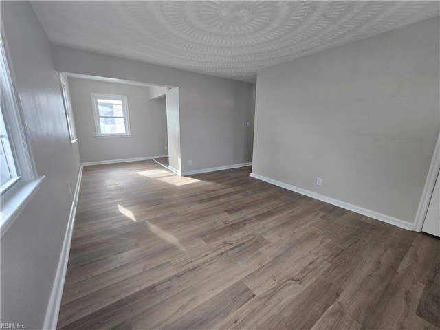 unfurnished room with hardwood / wood-style flooring