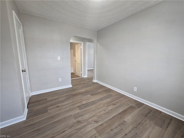 spare room featuring hardwood / wood-style flooring