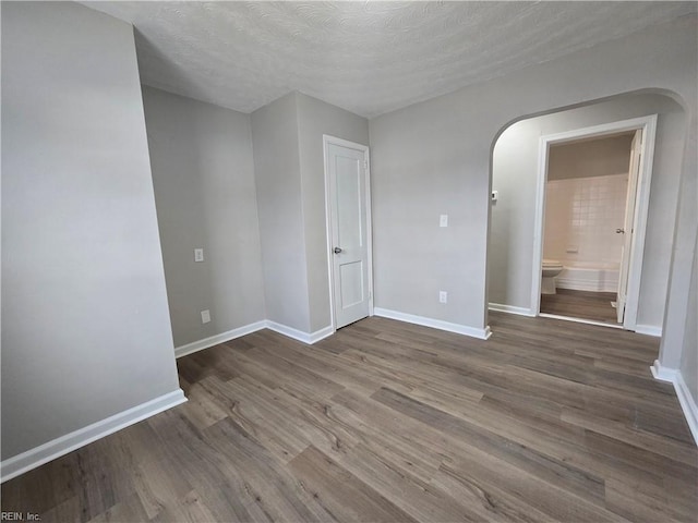 spare room with hardwood / wood-style flooring