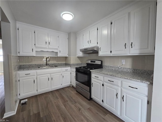 kitchen featuring range with gas cooktop, sink, white cabinets, light stone counters, and dark wood-type flooring