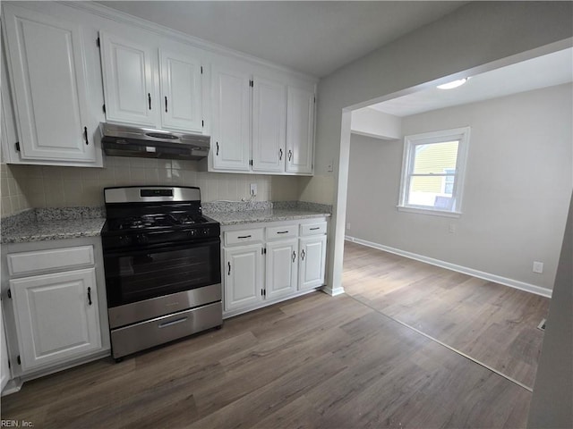 kitchen featuring white cabinetry, gas range, hardwood / wood-style floors, and light stone counters