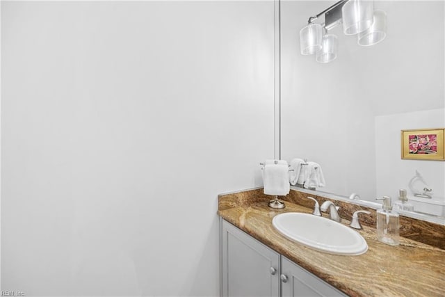 bathroom featuring vanity and vaulted ceiling