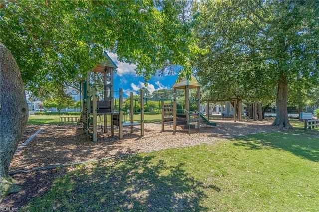 view of playground with a yard