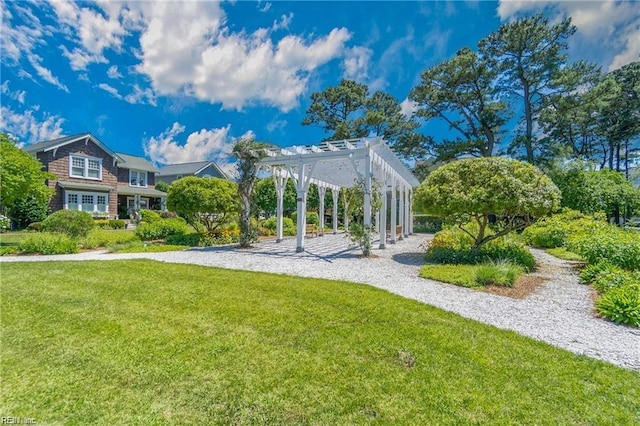 view of home's community featuring a pergola and a lawn