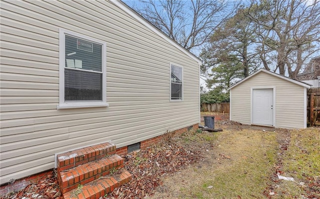 view of home's exterior featuring a storage shed