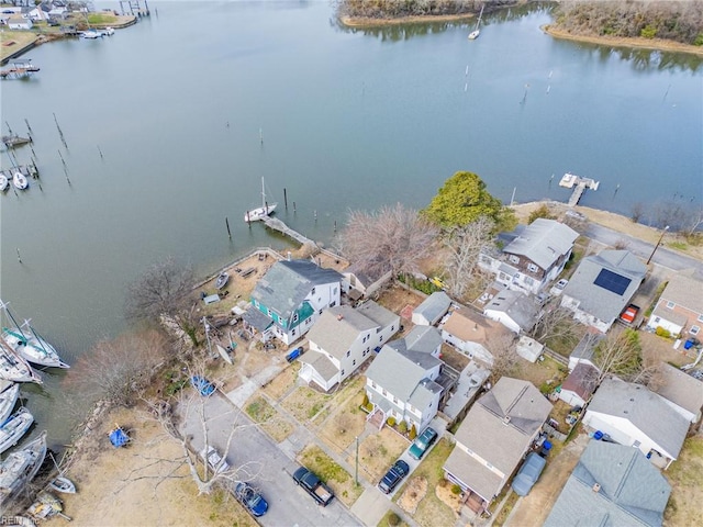 drone / aerial view with a residential view and a water view