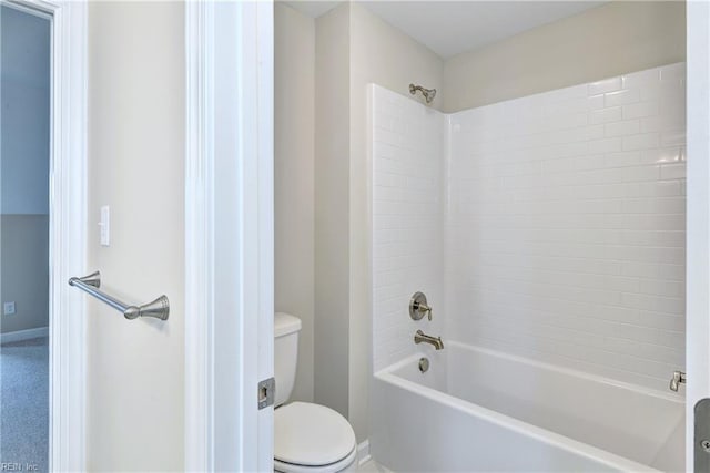 bathroom featuring shower / washtub combination and toilet