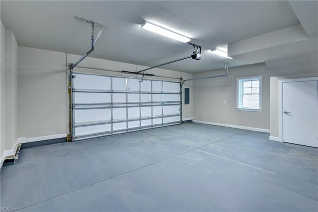 garage with electric panel, a garage door opener, and baseboards