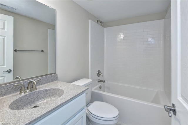 bathroom featuring washtub / shower combination, vanity, toilet, and visible vents