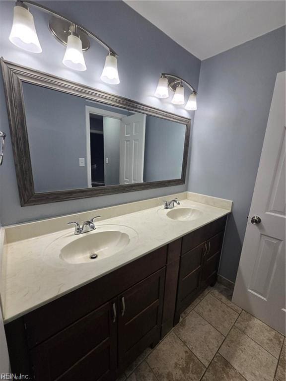 bathroom with tile patterned flooring and vanity