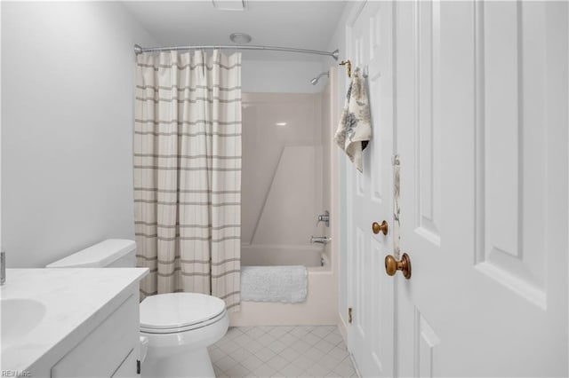 full bathroom with tile patterned flooring, shower / bath combo, vanity, and toilet