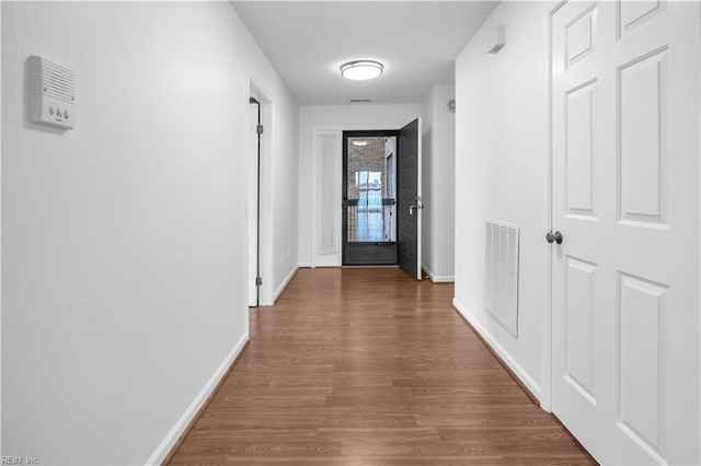 hallway featuring dark wood-type flooring