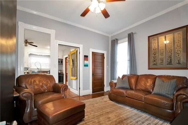 living room featuring ceiling fan, ornamental molding, and hardwood / wood-style floors