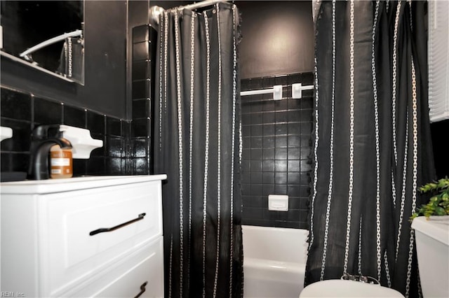 bathroom with tile walls, shower / tub combo with curtain, and toilet