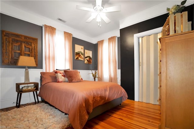 bedroom featuring hardwood / wood-style floors and ceiling fan