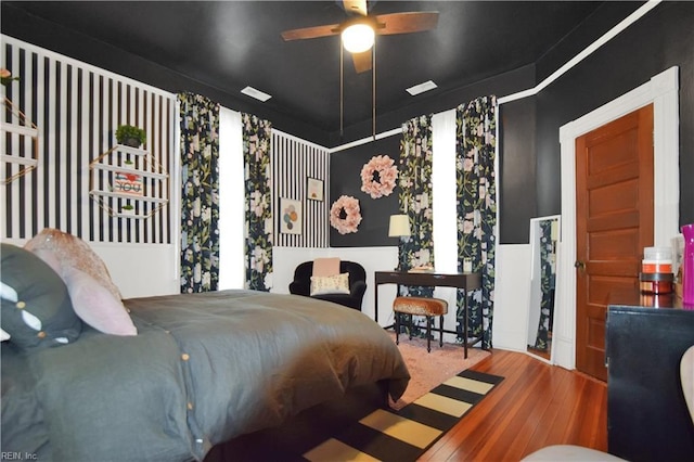 bedroom featuring hardwood / wood-style flooring and ceiling fan