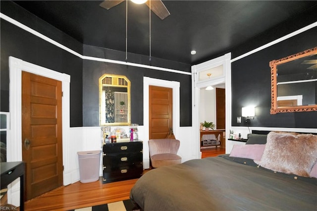 bedroom featuring ceiling fan and wood-type flooring