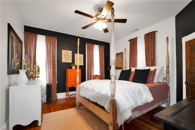 bedroom featuring hardwood / wood-style floors and ceiling fan