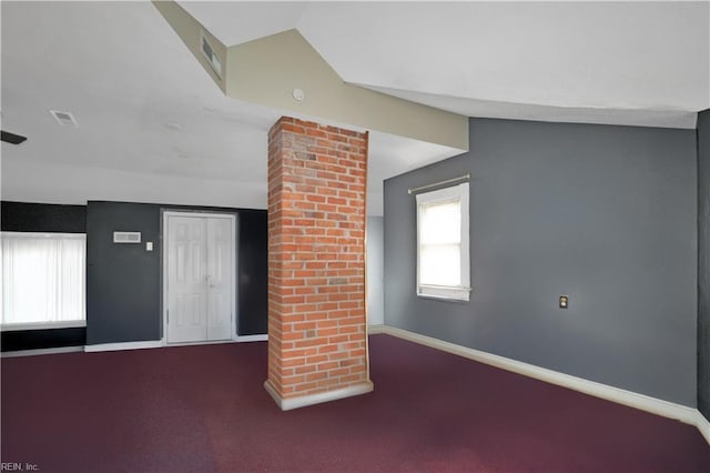 unfurnished living room featuring carpet floors and lofted ceiling