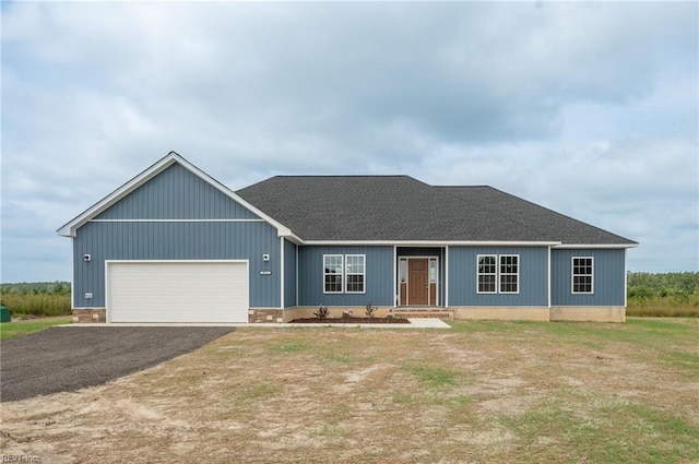 single story home featuring a garage